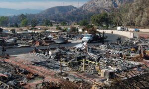 Burned neighborhood after wildfire showing destroyed homes, highlighting the importance of a property survey for evacuation safety