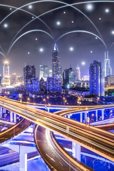 City with digital network lines showing how robotaxis rely on lidar mapping and real-time data to understand complex urban streets