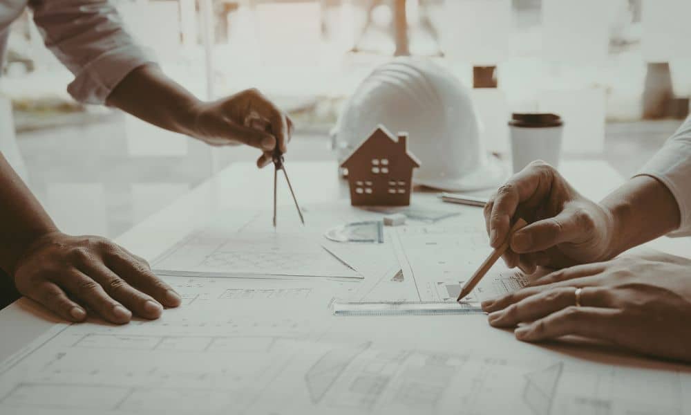 An ALTA title survey being reviewed alongside site plans to confirm property boundaries and easements during permit review