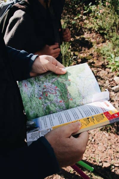 Engineer reviewing a topographic map for hillside planning and drone surveying project

